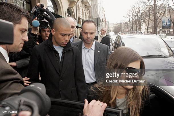 Brazilian footballer Ronaldo and fiance Daniela Cicarelli leave their Paris hotel, The Plaza, to go back to Barcelona on February 15, 2005 in Paris,...