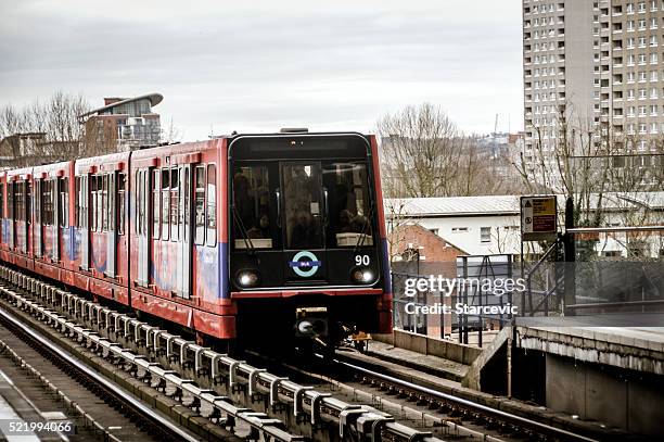 docklands light railway station in canary wharf, london - docklands light railway stock pictures, royalty-free photos & images