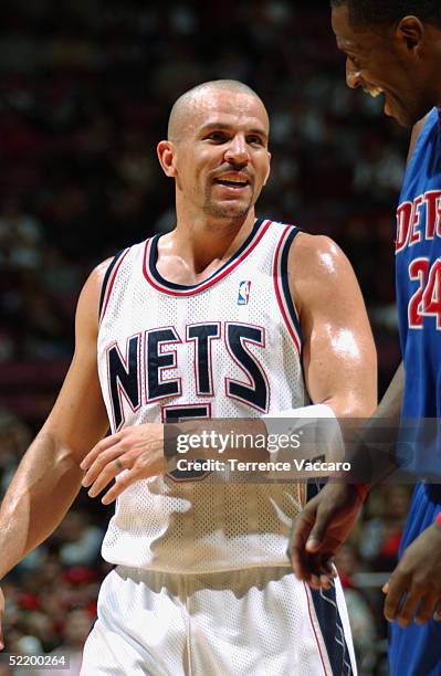 Jason Kidd of the New Jersey Nets laughs with Antonio McDyess of the Detroit Pistons during the game on February 5, 2005 at Continental Airlines...