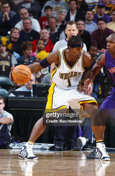 Stephen Jackson of the Indiana Pacers is defended by Eric Williams of the Toronto Raptors during the game at Conseco Fieldhouse on February 2, 2005...