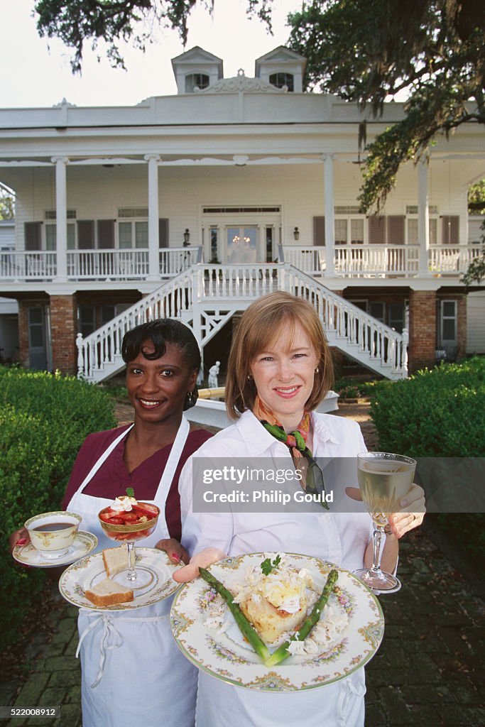 Chef and Helper Displaying Dishes