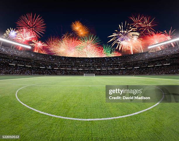 soccer field and stadium with fireworks. - internationale fußballveranstaltung stock-fotos und bilder