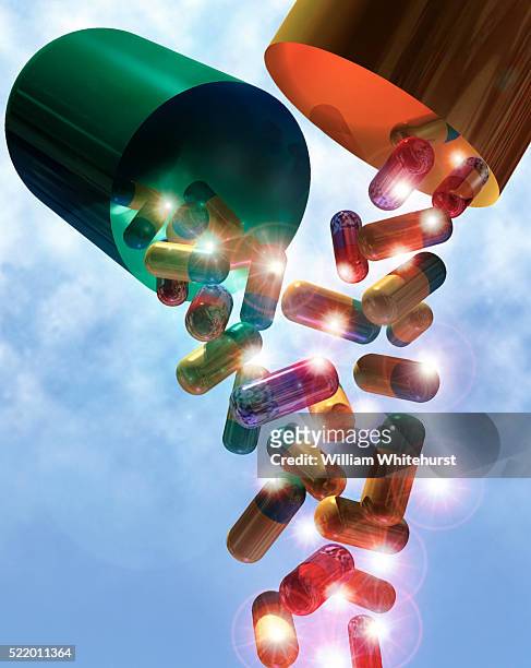 pouring capsules - pills colorful stock pictures, royalty-free photos & images