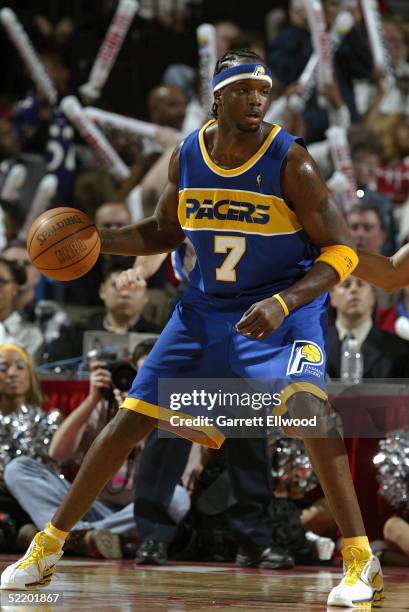 Jermaine O'Neal of the Indiana Pacers dribbles the ball against the Houston Rockets on January 18, 2005 at the Toyota Center in Houston, Texas. The...