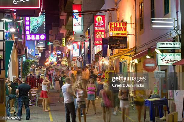 bustling nighttime street on ibiza - sant antoni de portmany stock pictures, royalty-free photos & images