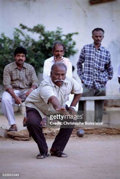 playing boules in pondicherry - petanque court stock pictures, royalty-free photos & images
