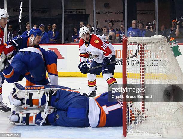 Reilly Smith of the Florida Panthers scores at 2:25 of the first period against Thomas Greiss of the New York Islanders during Game Three of the...