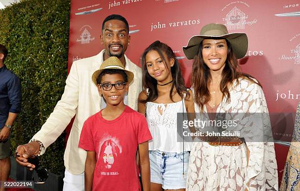 Actor Bill Bellamy and actress Kristen Baker Bellamy with family, attend the John Varvatos 13th Annual Stuart House benefit presented by Chrysler...