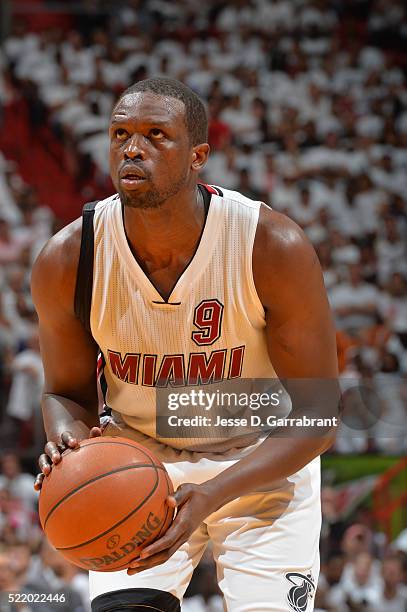 Luol Deng of the Miami Heat shoots a foul shot against the Charlotte Hornets during the Eastern Conference playoffs First Round Game One on April 17,...