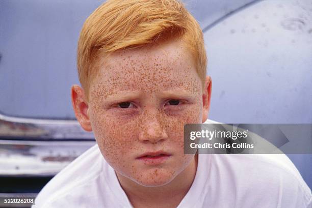 boy with red hair and freckles - red hair boy and freckles stock-fotos und bilder