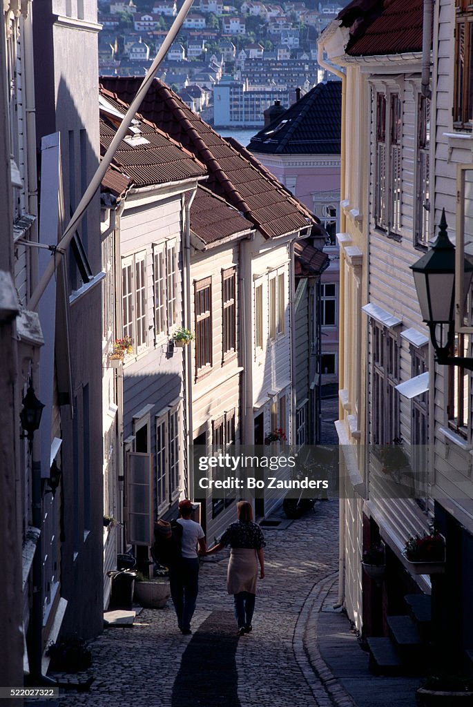Couple Walking Down Narrow Street