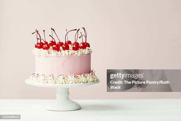 cake decorated with maraschino cherries - maraschino stock pictures, royalty-free photos & images