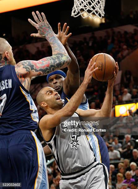 Tony Parker of the San Antonio Spurs drives in front of Zach Randolph of the Memphis Grizzlies in Game One of the Western Conference Quarterfinals...