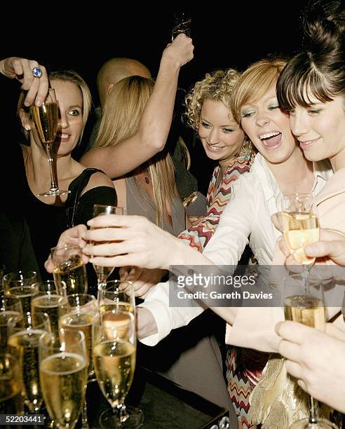 Natasha Hamilton tucks into the champagne on arrival at the afterparty following the Elle Style Awards 2005 at the Z Rooms, Truman Brewery on...