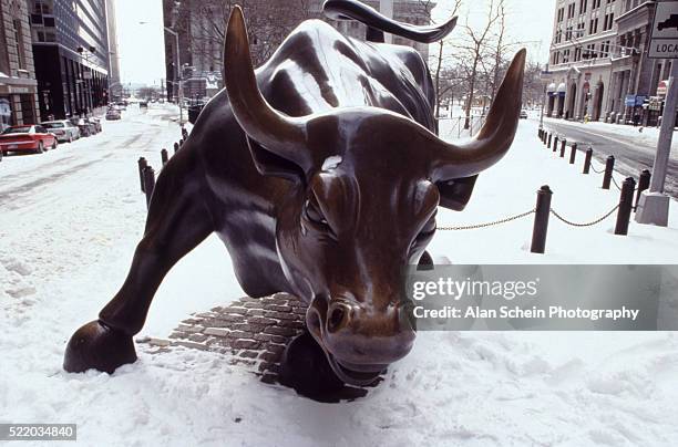 bull statue outside new york stock exchange - nyse bull stock pictures, royalty-free photos & images