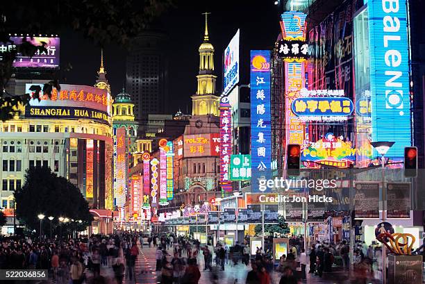 nanjing road bright lights in shanghai - nanjing road stock pictures, royalty-free photos & images