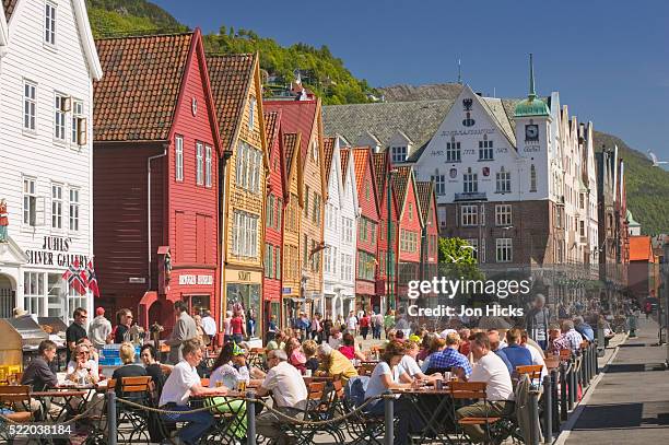 people at sidewalk cafes in bergen - bergen foto e immagini stock