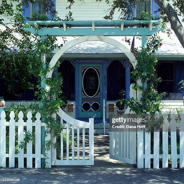 white picket fence and gate leading to front entrance of victorian home - white picket gate stock pictures, royalty-free photos & images