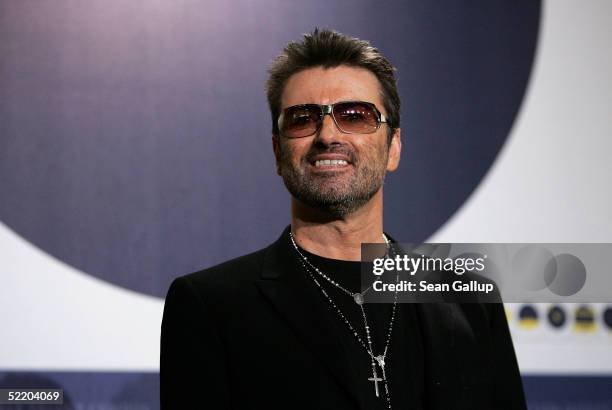 Singer George Michael poses at the "George Michael: A Different Story" Photocall during the 55th annual Berlinale International Film Festival on...