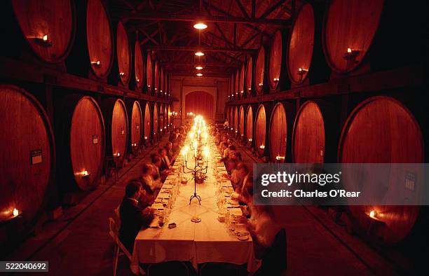 dining among the wine casks - st helena ethnicity stock pictures, royalty-free photos & images