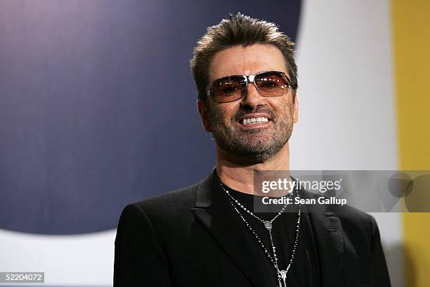 Singer George Michael poses at the "George Michael: A Different Story" Photocall during the 55th annual Berlinale International Film Festival on...