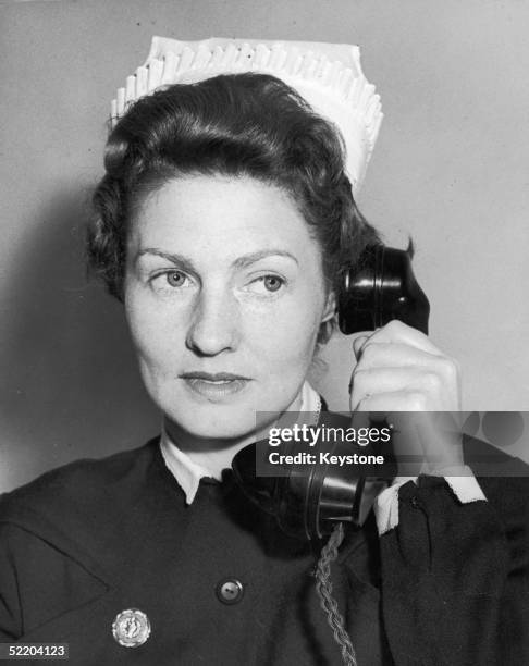 Matron Dorothy Woods takes a call at the New Victoria Hospital, Kingston-on-Thames, 28th May 1958. The Hospital is the first voluntary Hospital to be...