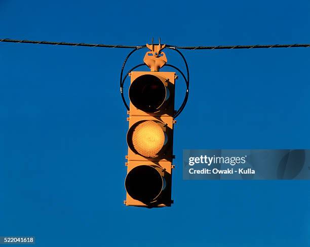 traffic light on yellow - yellow light stock pictures, royalty-free photos & images