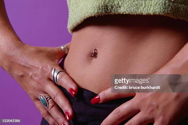 pierced navel - belly ring stock pictures, royalty-free photos & images