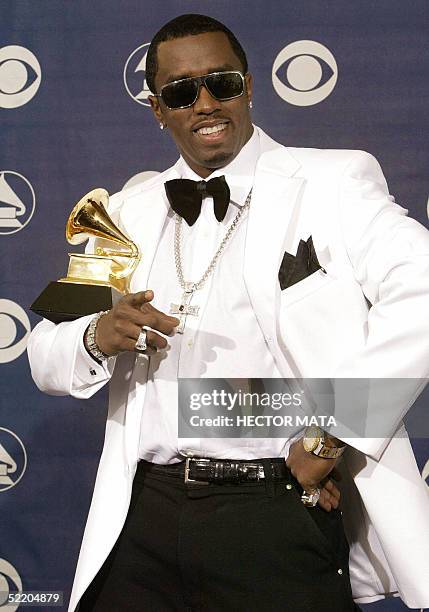 Diddy mugs for the camera with a Grammy award during the 46th Annual Annual Grammy Awards 08 February 2004 at the Staples Center in Los Angeles. It...
