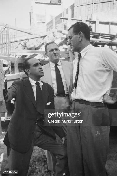 Brazilian architect Oscar Niemeyer visits the site of a new office block being built in Rio de Janeiro for the weekly illustrated paper 'O Cruzeiro',...