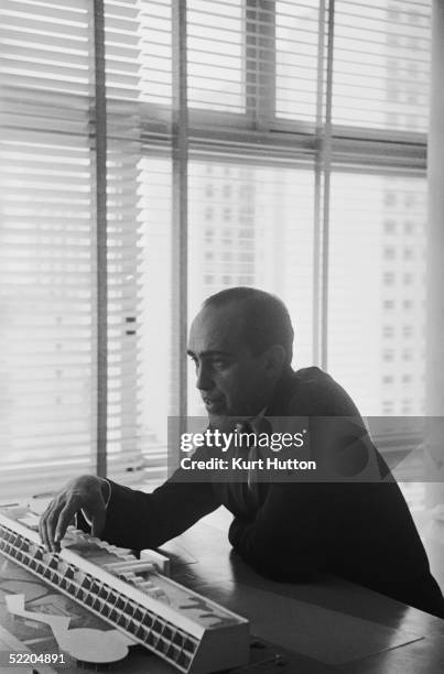 Brazilian architect Oscar Niemeyer discusses one of his designs, 3rd June 1960. Original Publication : Picture Post - 4971 - Niemeyer: A South...