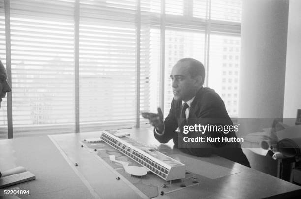 Brazilian architect Oscar Niemeyer discusses one of his designs, 3rd June 1960. Original Publication : Picture Post - 4971 - Niemeyer: A South...