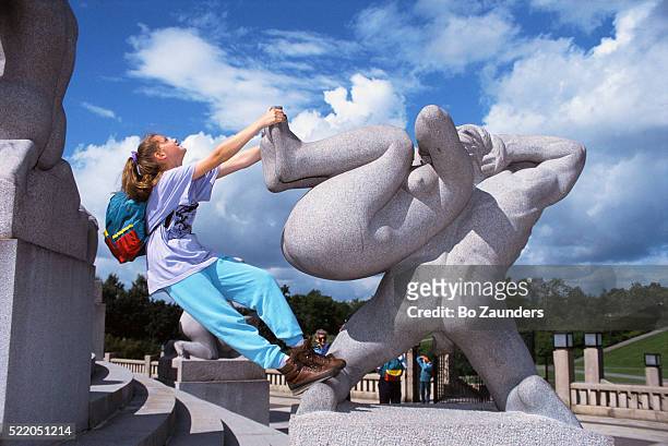 girl playing at vigeland sculpture park - vigeland sculpture park stock pictures, royalty-free photos & images