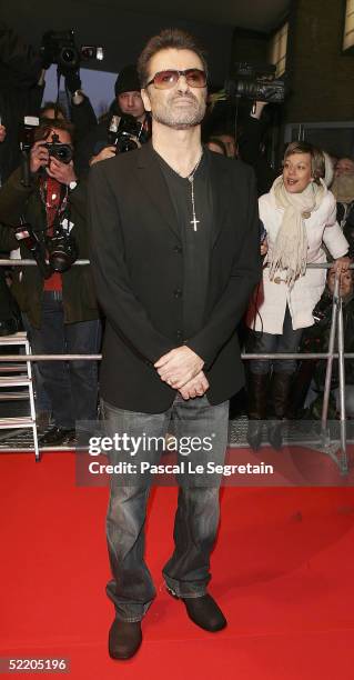 Singer George Michael arrives at the "George Michael - A Different Story" World Premiere at Kino International during the 55th annual Berlinale...