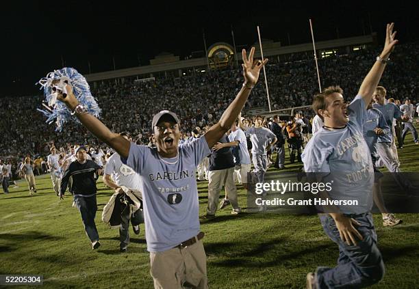 North Carolina Tar Heels fans storm the field following the game against the North Carolina State Wolfpack on October 9, 2004 at Kenan Stadium...