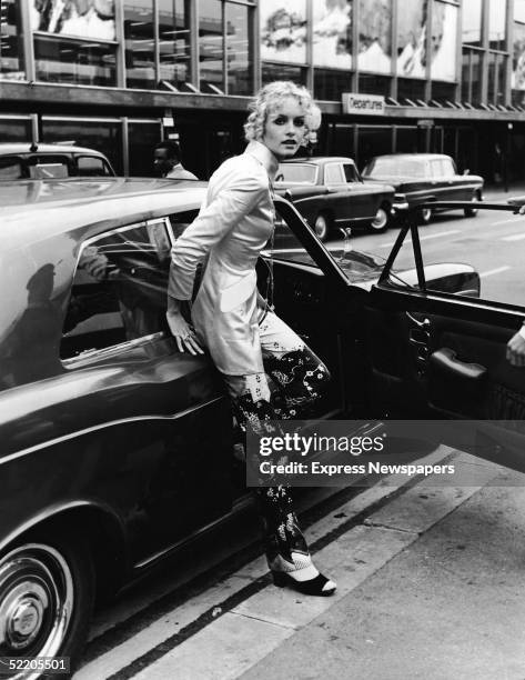 British model and actress Twiggy steps from a Rolls Royce car at an airport shortly after retiring from modelling, October 3, 1970.