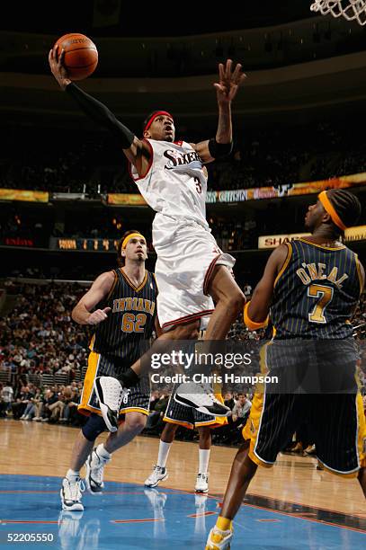 Allen Iverson of the Philadelphia 76ers shoots against Jermaine O'Neal of the Indiana Pacers during the game at Wachovia Center on January 31, 2005...