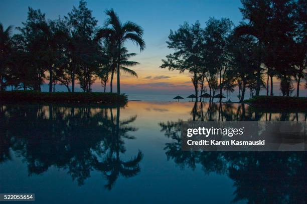 reflections at a vietnamese resort pool - danang stock pictures, royalty-free photos & images