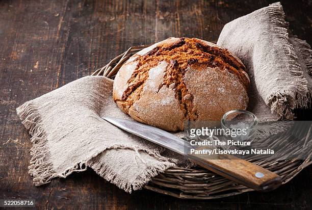 fresh bread on wooden table - rye bread stock pictures, royalty-free photos & images