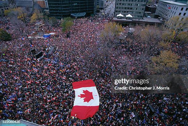 marching in streets during canadian unity rally - canada government stock pictures, royalty-free photos & images