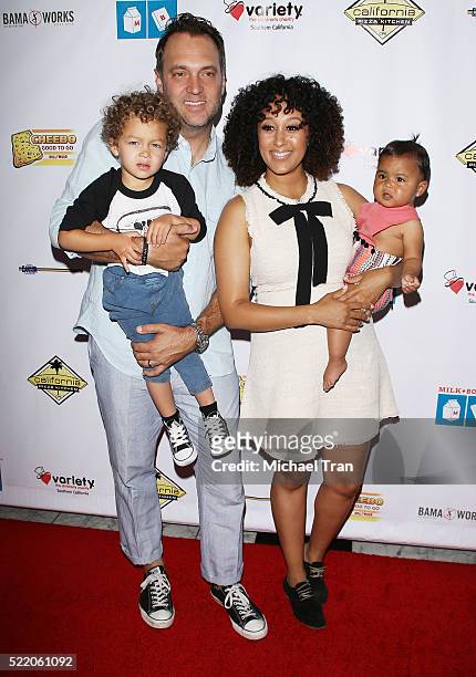 Adam Housley, Aden John Tanner Housley, Tamera Mowry and Ariah Talea Housley arrive at the 7th Annual Milk + Bookies' Story Time celebration held at...
