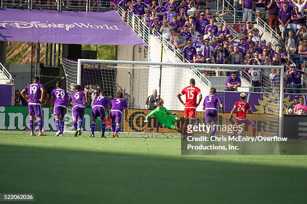 Lee Nguyen of the New England Revolution scores penalty kick against the Orlando City Lions at the Citrus Bowl in Orlando, Florida on April 17, 2016.