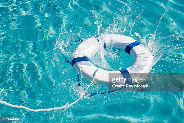 life ring in swimming pool - rettungsring stock-fotos und bilder