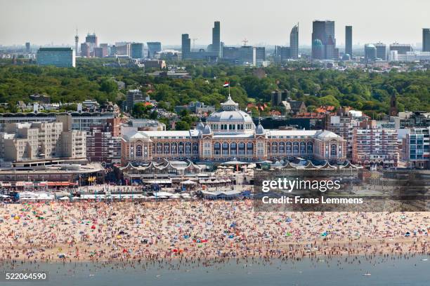 netherlands, scheveningen, people sunbathing on beach - scheveningen stock-fotos und bilder