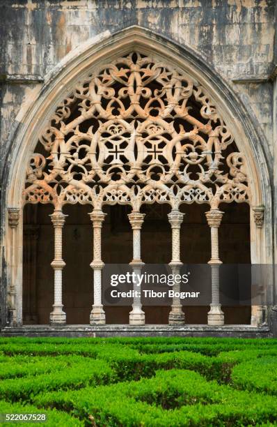 ornate stonework at abbey of batalha - cloister stock pictures, royalty-free photos & images