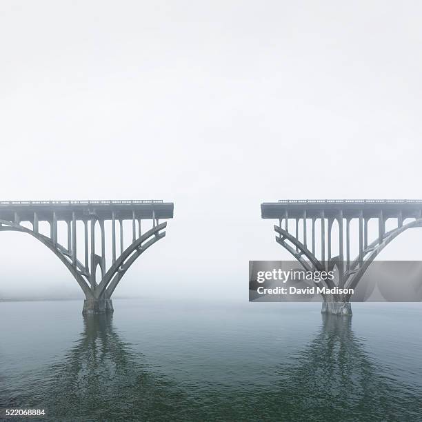 unconnected bridge above water - abseits stock-fotos und bilder