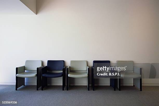 row of chairs in office - waiting room stock pictures, royalty-free photos & images
