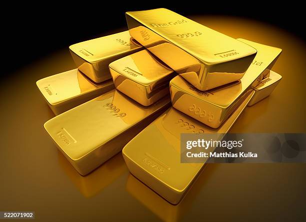 stack of gold bars - goldbarren stock-fotos und bilder