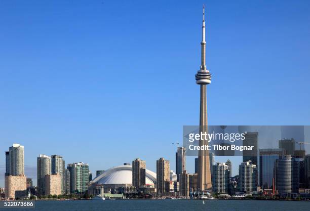 toronto, skyline, rogers centre, cn tower - day toronto stock pictures, royalty-free photos & images