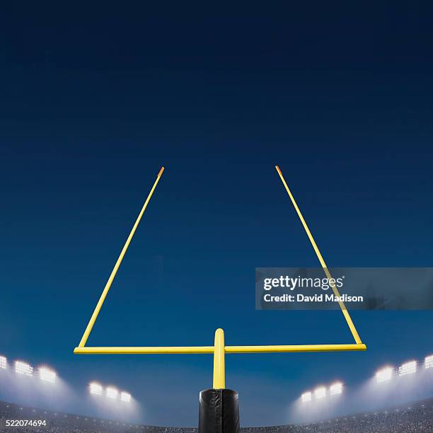 american football goal post and stadium - goal posts stockfoto's en -beelden